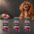 Zestaw 6 puszek karmy mokrej John Dog Kozina Pure Black po 400 g obok psa