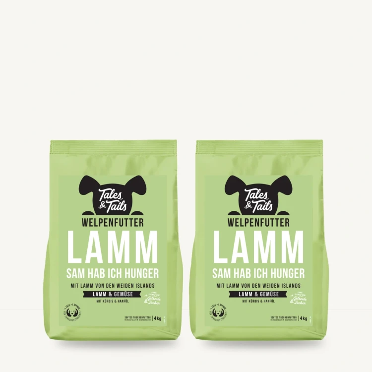 Zestaw Tales & Tails 2 × 4 kg z jagnięciną dla szczeniąt na jasnym tle.