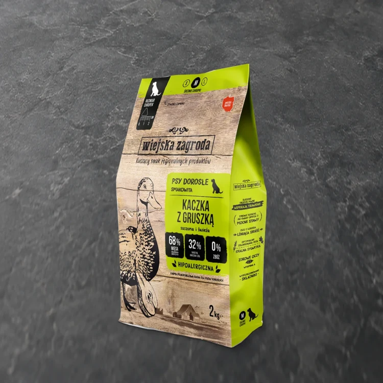 Worek 2 kg karmy suchej Wiejska Zagroda Kaczka z gruszką na ciemnym kamiennym tle.