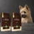 Dwa worki karmy EMPIRE Legendary Taste Puppy Growth Diet dla szczeniąt małych i średnich ras po 12 kg obok szczeniaka cairn terriera na ciemnym tle