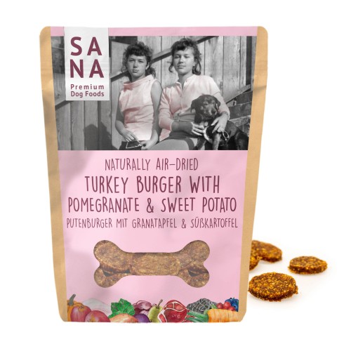 Torebka SANA Dog Turkey Burger with Pomegranate & Sweet Potato z różową etykietą oraz burgerami obok